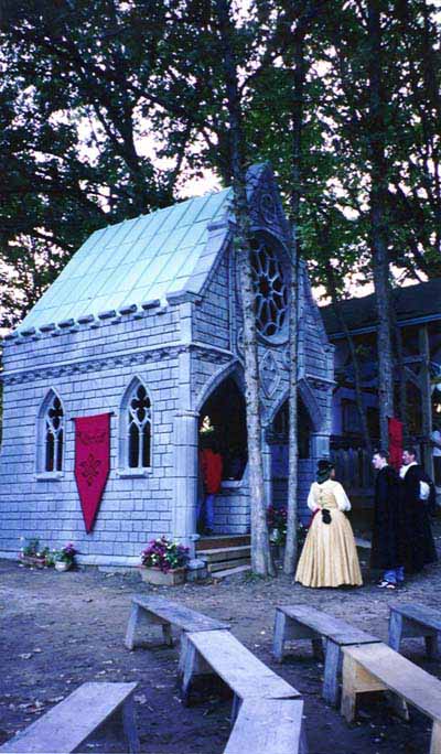 Near-life-size model of a Gothic chapel on Renaissance Faire grounds