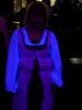 Solveig in Italian Renaissance garb stands underneath a 

      black light in a bowling alley, thus creating the Empire Waistline Dress of Doom!
